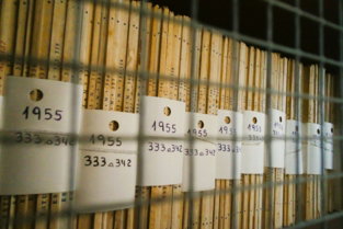 a-group-of-white-signs-on-a-metal-rack.jpg a group of white signs on a metal rack