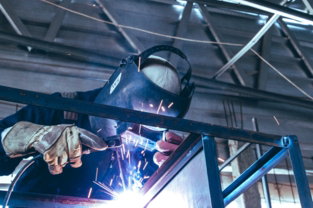 a-welder-working-on-a-piece-of-metal.jpg a welder working on a piece of metal